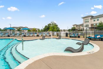 resort style pool with lounge chairs on in-water ledge at Sycamore at Tyvola, Charlotte, NC, 28217